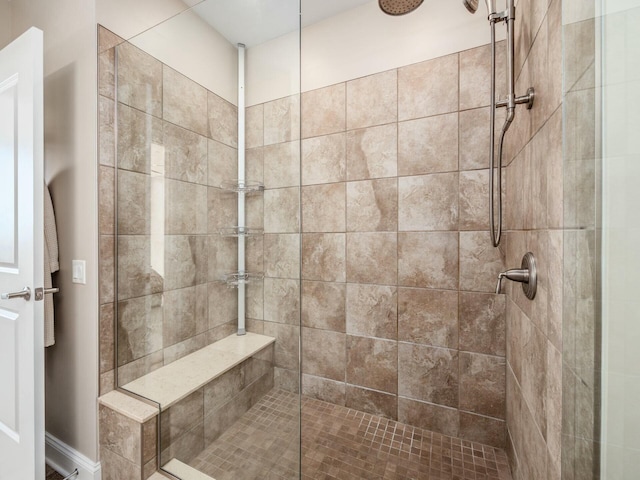 bathroom featuring tiled shower