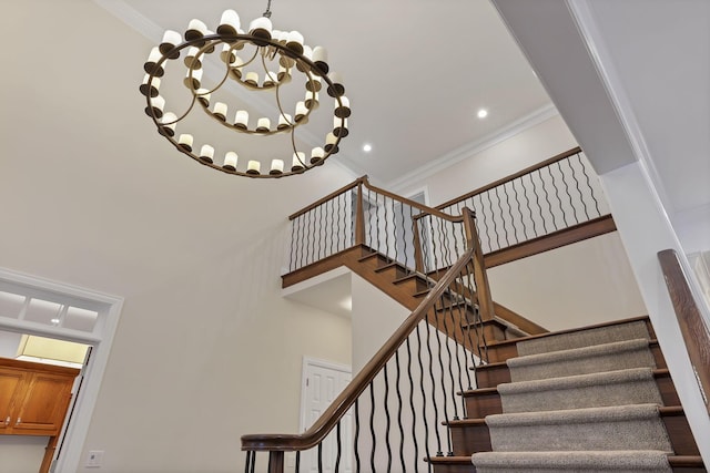 stairs with crown molding and a notable chandelier