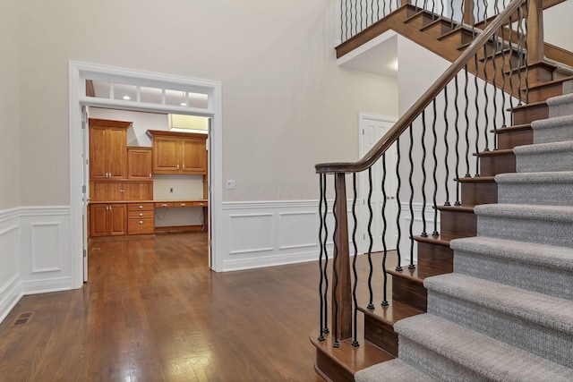 stairs with hardwood / wood-style flooring