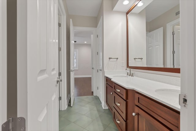 bathroom with tile patterned floors and vanity