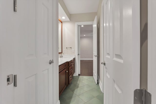 bathroom with tile patterned flooring and vanity