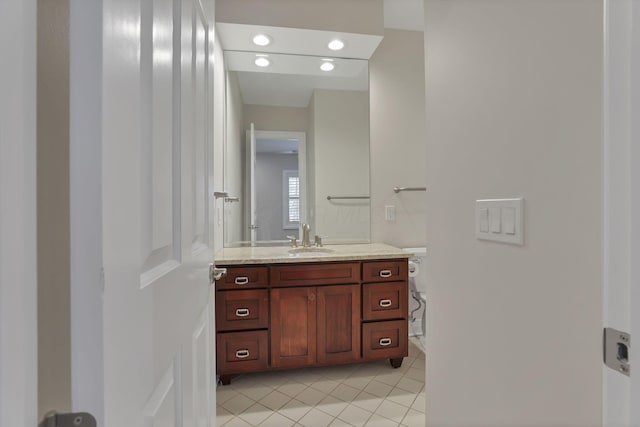 bathroom with tile patterned floors and vanity