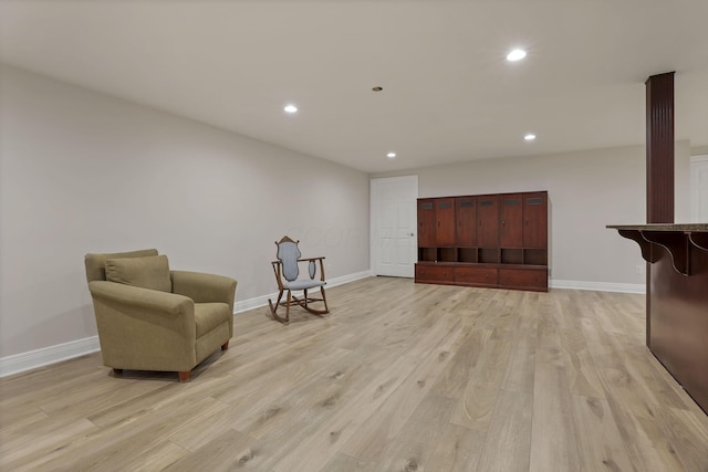 sitting room with light hardwood / wood-style flooring