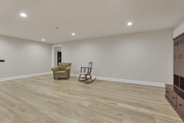 sitting room featuring light hardwood / wood-style flooring