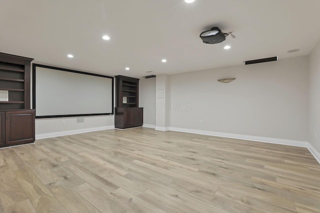 cinema room featuring light hardwood / wood-style floors