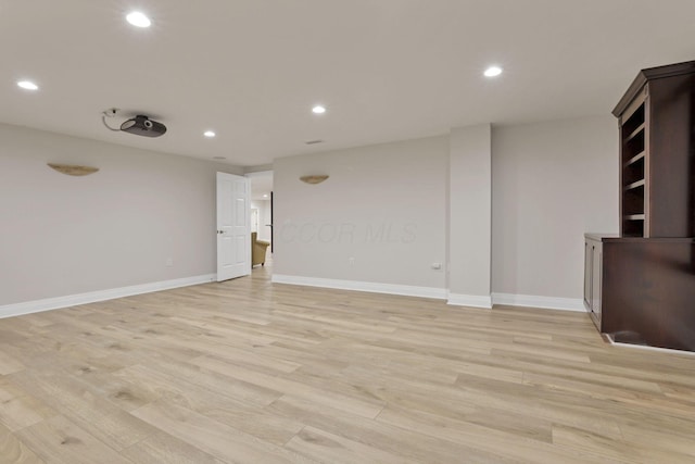 unfurnished living room featuring light hardwood / wood-style flooring