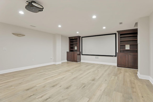 home theater room with light hardwood / wood-style flooring