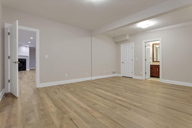 unfurnished room with light hardwood / wood-style flooring