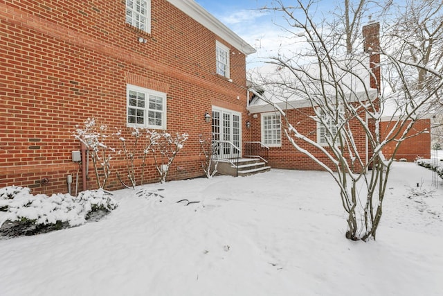 view of snow covered house