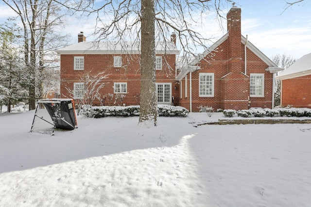 view of snow covered house