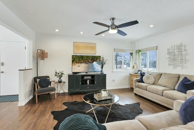 living room with dark hardwood / wood-style floors and ceiling fan