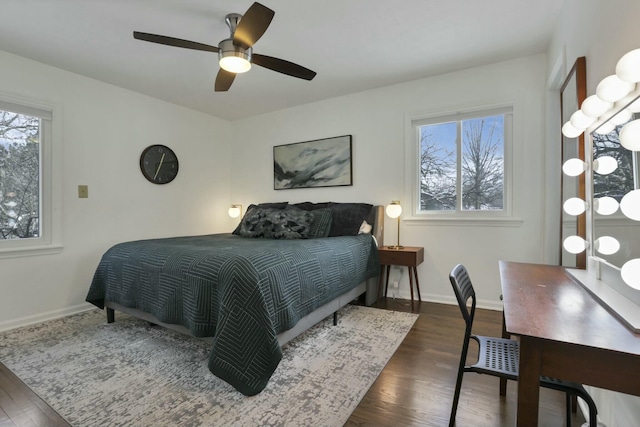 bedroom featuring ceiling fan and dark wood-type flooring