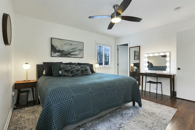 bedroom with ceiling fan and dark wood-type flooring