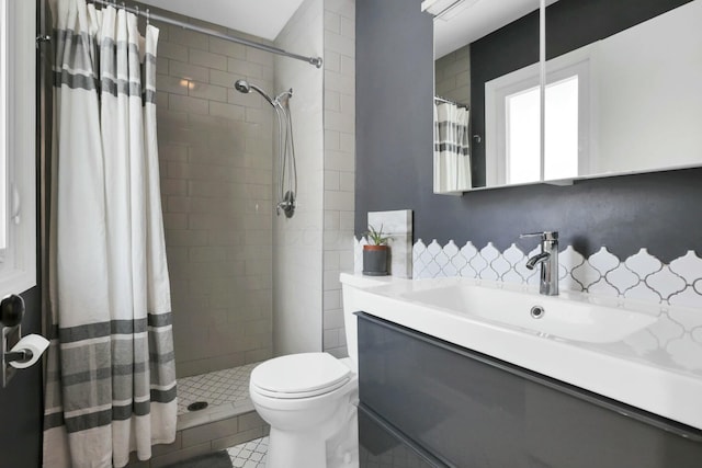 bathroom with decorative backsplash, vanity, tile patterned flooring, toilet, and curtained shower