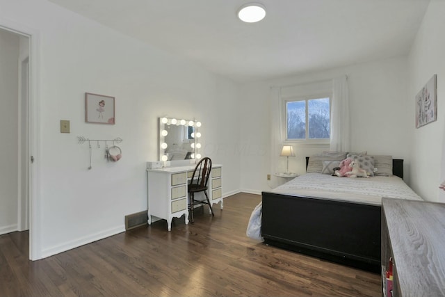 bedroom featuring dark wood-type flooring