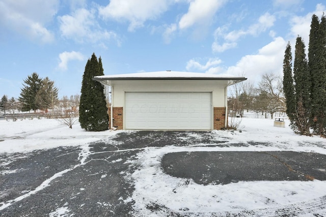 view of snow covered garage