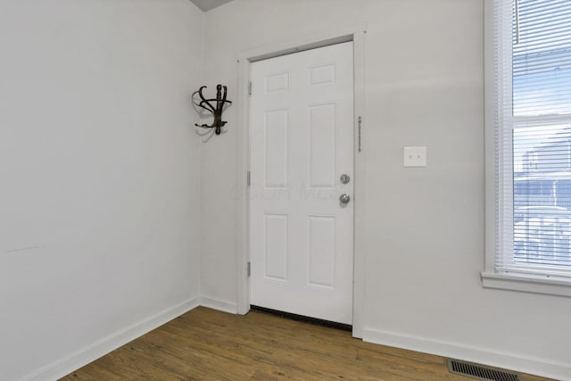 foyer entrance with dark hardwood / wood-style flooring