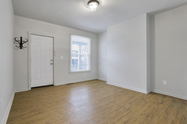 entrance foyer with hardwood / wood-style floors