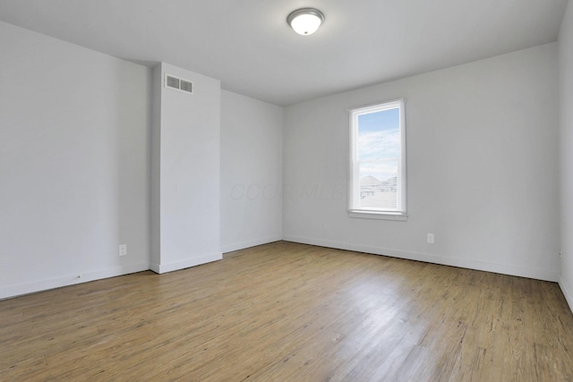 unfurnished room featuring light hardwood / wood-style floors