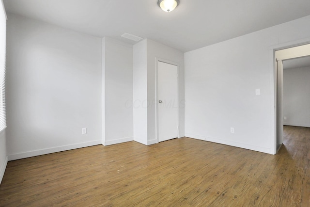 empty room featuring hardwood / wood-style flooring