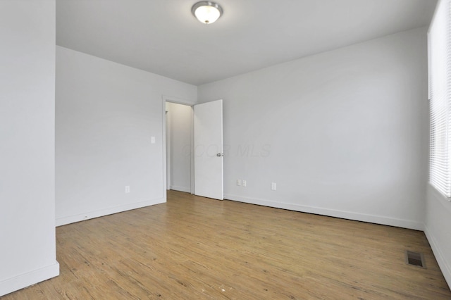 unfurnished room featuring light wood-type flooring