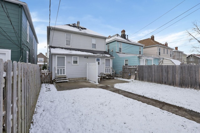 view of snow covered house