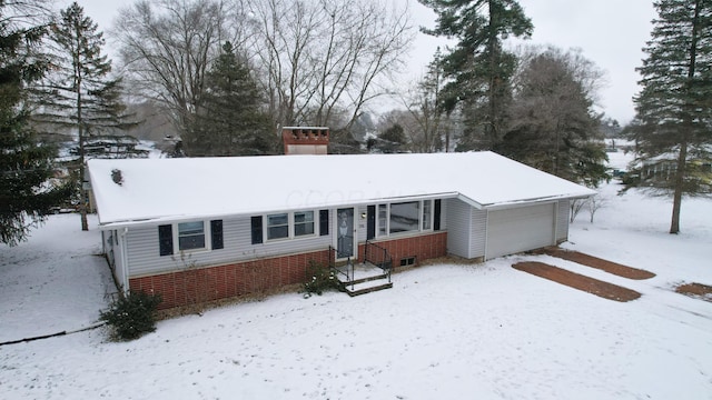 ranch-style house featuring a garage