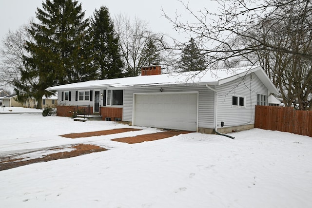 ranch-style home featuring a garage