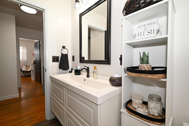 bathroom with vanity and wood-type flooring