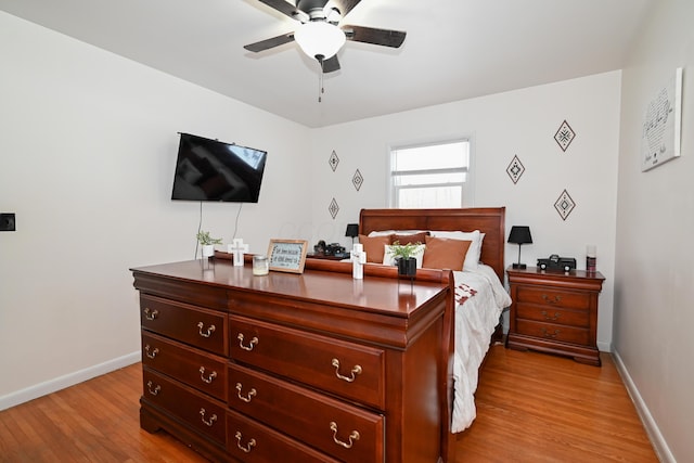 bedroom featuring ceiling fan and light hardwood / wood-style flooring