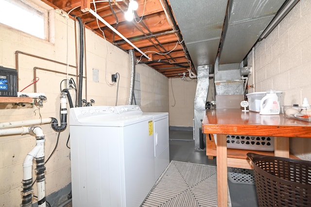 clothes washing area featuring separate washer and dryer