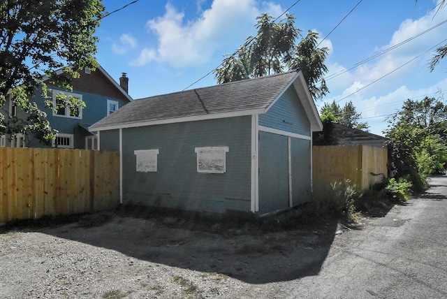 view of side of property with an outdoor structure