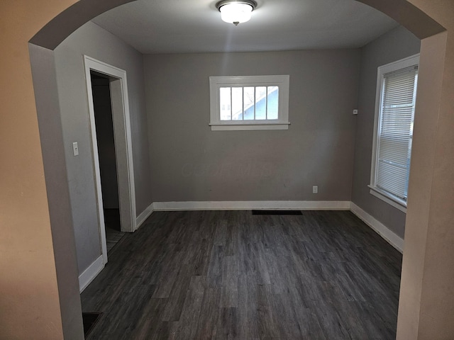 empty room featuring dark wood-type flooring