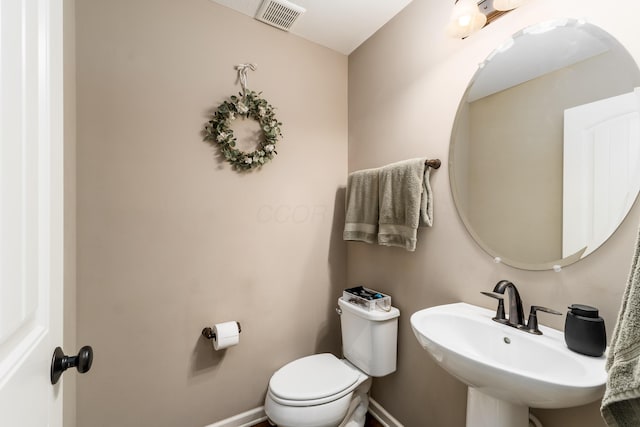 bathroom with sink and toilet