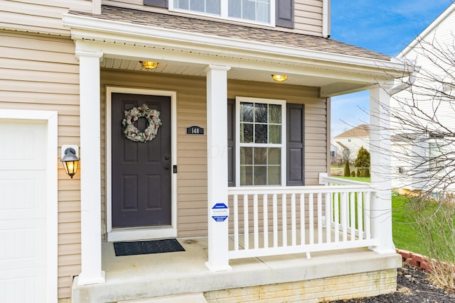 property entrance featuring a porch