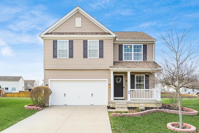 view of front property with a garage, covered porch, and a front yard