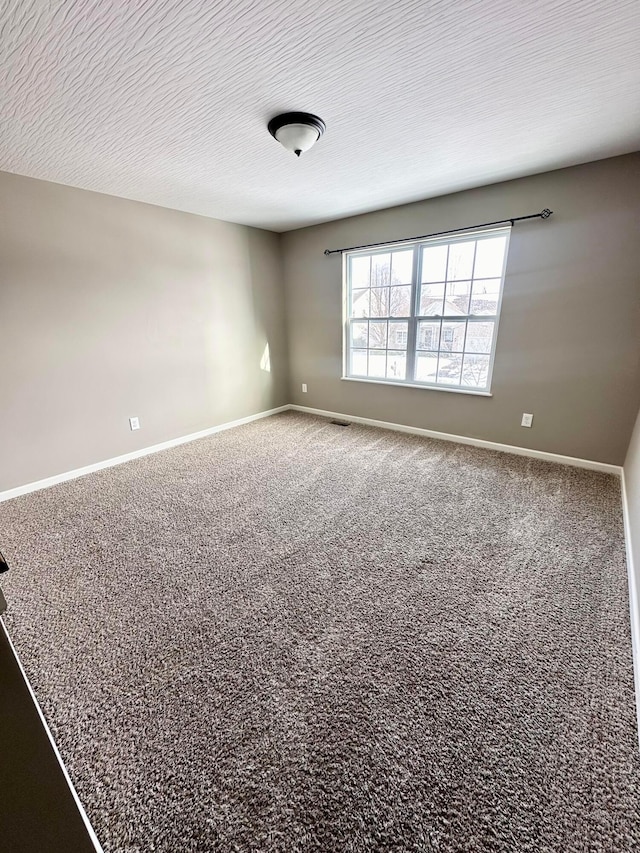 unfurnished room with carpet floors