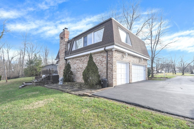 view of property exterior with a garage and a lawn