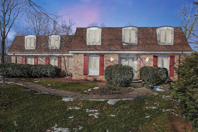 view of front of home with a yard