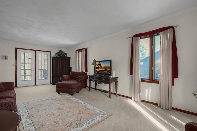 living room with french doors and light colored carpet