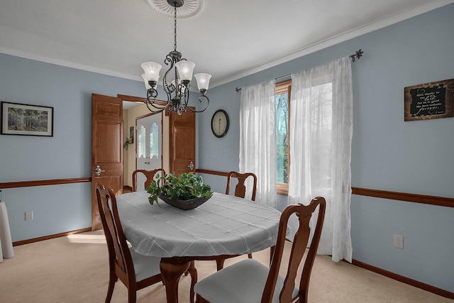 carpeted dining space with crown molding and a notable chandelier