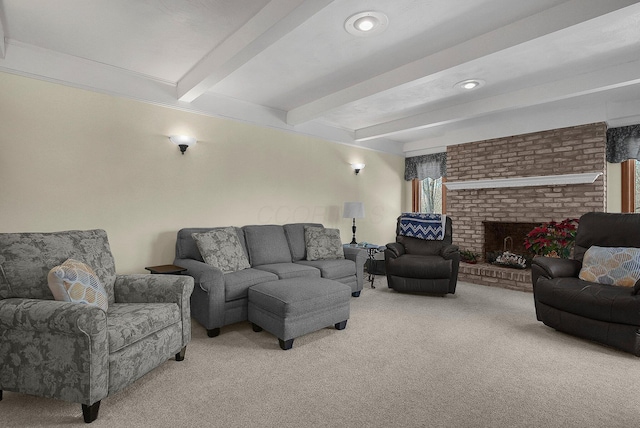 carpeted living room featuring beam ceiling and a fireplace