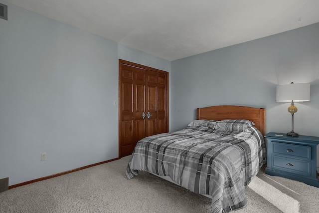 carpeted bedroom featuring a closet