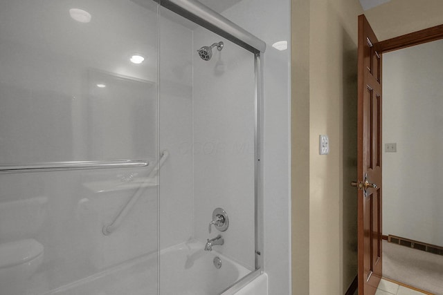 bathroom featuring shower / bath combination and tile patterned flooring