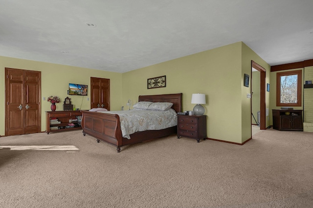 bedroom featuring light carpet