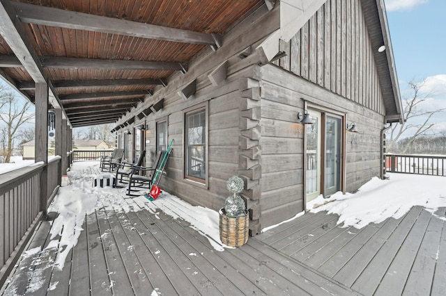 view of snow covered deck