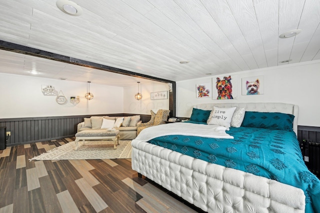 bedroom featuring hardwood / wood-style flooring, crown molding, and wood ceiling