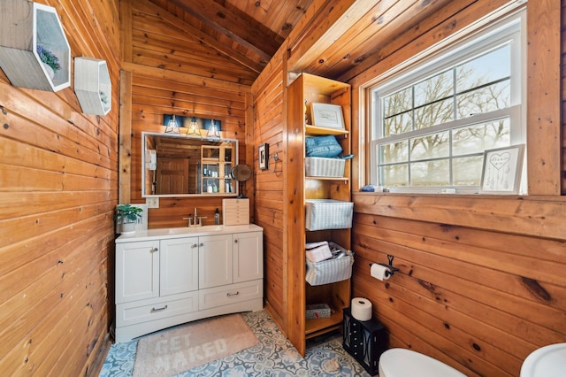 bathroom with wooden walls, vanity, wood ceiling, and vaulted ceiling