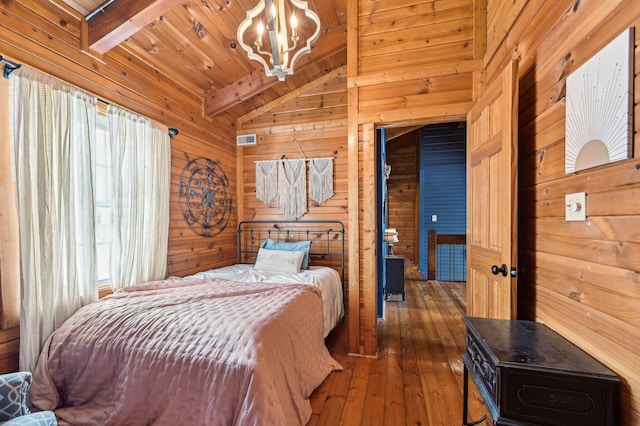 bedroom with wooden ceiling, lofted ceiling with beams, dark hardwood / wood-style floors, a notable chandelier, and wood walls