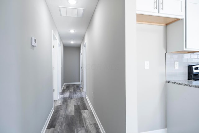 hallway featuring dark hardwood / wood-style floors